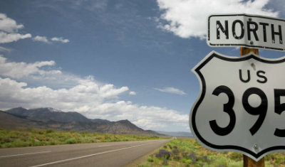 sign post image of US 395 on blue sky background